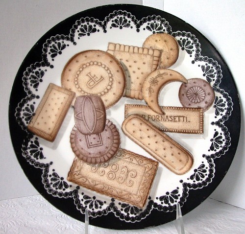 Inventory:  Piero Fornasetti, Piero Fornasetti Biscotti Porcelain Plate, #4 in series., 1950s-Early 1960s., SOLD •