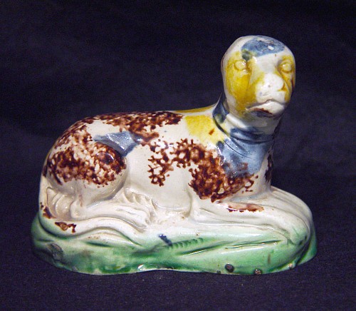 Inventory:  Creamware Pottery, 18th-century English Creamware Whieldon-type Pottery Figure of a Recumbent Dog, Circa 1775, $1,800